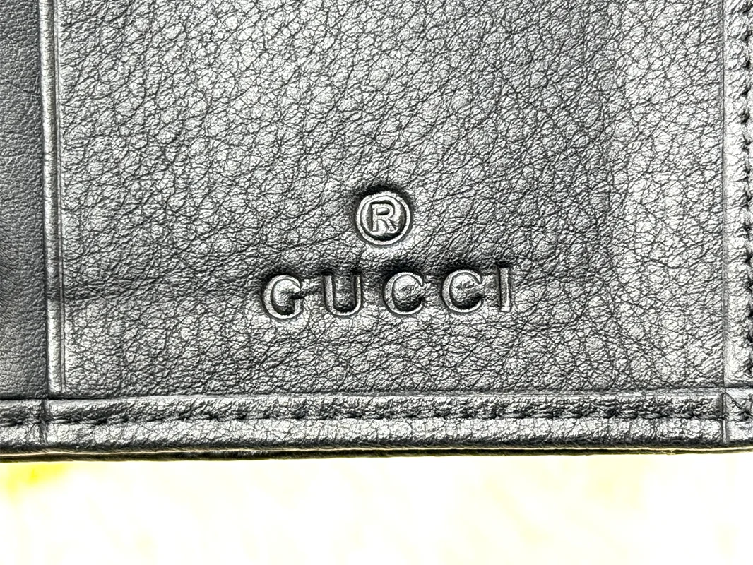 Gucci Black GG Embossed Wallet