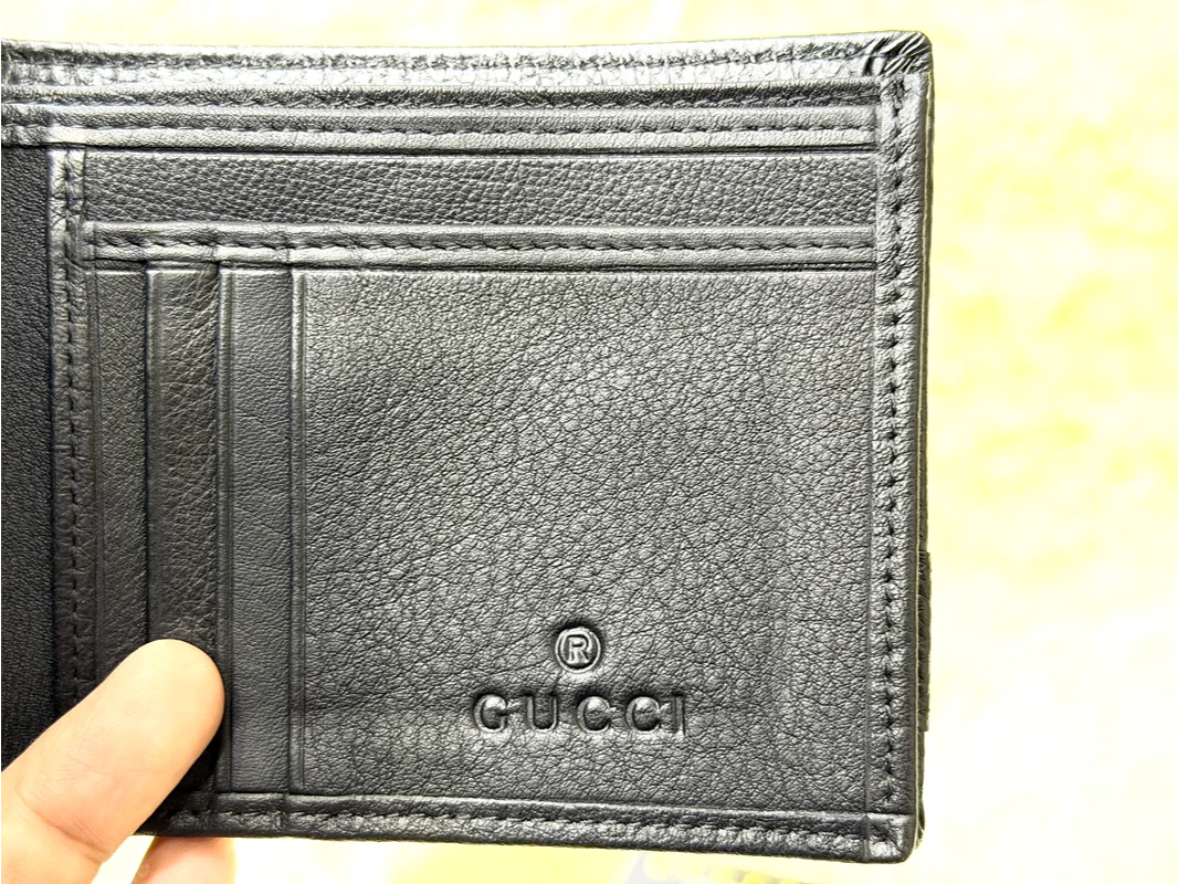Gucci Black GG Embossed Wallet