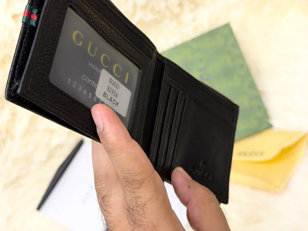 Gucci Black Textured Bifold Wallet with Web Stripe Detail
